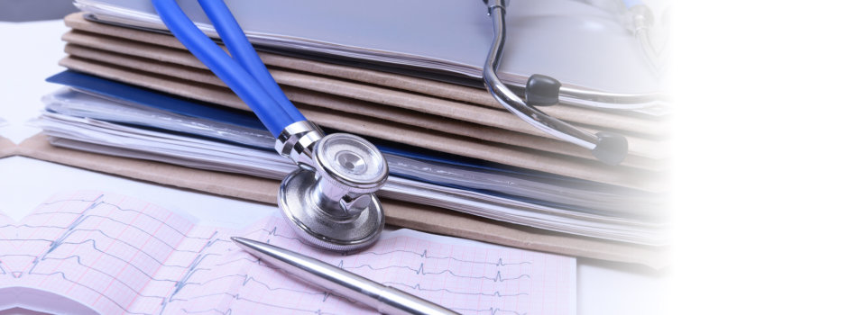 files and stethoscope on the desk
